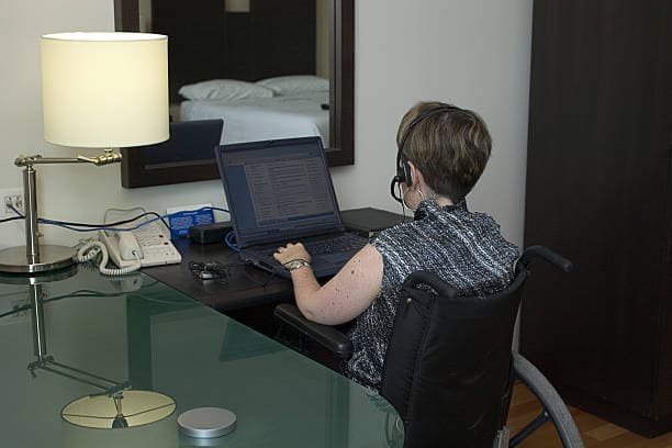Participant working independently from a hotel room